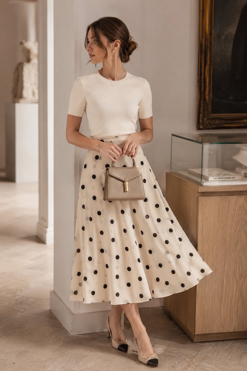 polka dot style outfit idea with an elegant dotted midi skirt and refined neutral accessories
