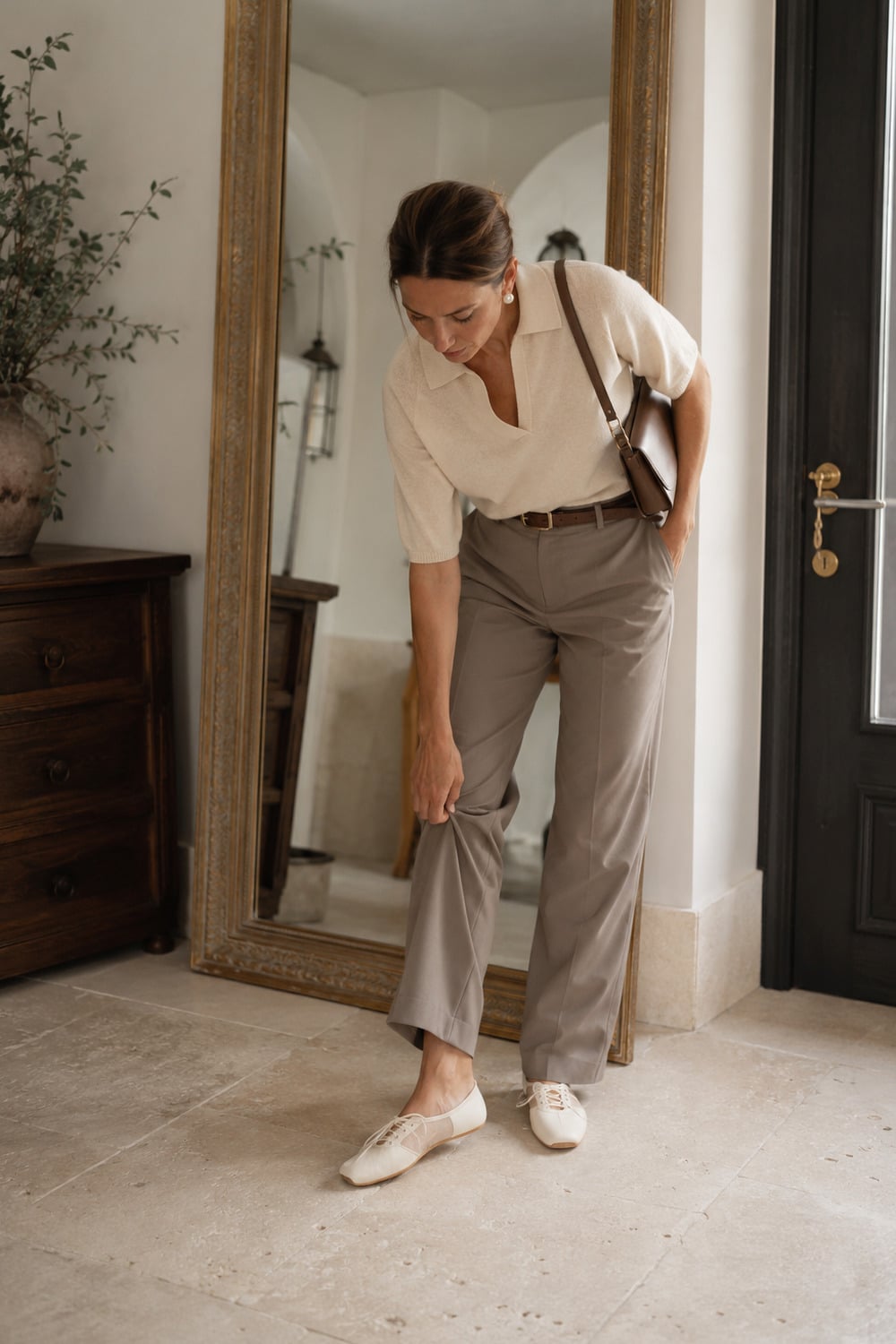 Ballet Sneaker Style for Everyday Elegance Ballet sneaker style with ivory shoes beside relaxed taupe trousers and a soft cream knit in a refined late summer setting